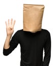 Man covering his head using a paper bag. four