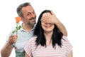 Man covering woman eyes for rose gift Royalty Free Stock Photo