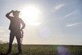 A man cowboy hat and a loso in the field. American farmer in a f Royalty Free Stock Photo