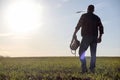 A man cowboy hat and a loso in the field. American farmer in a f Royalty Free Stock Photo