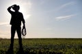 A man cowboy hat and a loso in the field. American farmer in a f