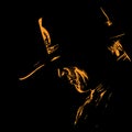 Man with cowboy hat silhouette in backlight. Illustration.