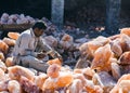 A man crafting salt lamps