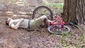 A man crashed into a tree while cycling in forest and lost consciousness. An accident while cycling.