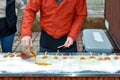 Man creates Maple taffy in the snow Royalty Free Stock Photo
