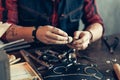 Man creating jewellery items like earrings, necklaces, rings, brackets