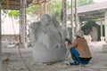 Man Creating Marble Buddha Sculpture. Vietnam