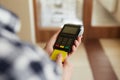 Man with credit card and payment terminal