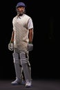 Man, cricket and athlete for sports game in studio for professional match, competition or black background. Male person Royalty Free Stock Photo