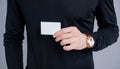 Man crop view holding debit credit bank card. Showing business card. Businesscard in male hand Royalty Free Stock Photo