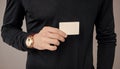 Man crop view holding debit credit bank card. Showing business card. Businesscard in male hand Royalty Free Stock Photo