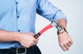 Man cropped view break wrist watch device with claw hammer tool, kill time Royalty Free Stock Photo