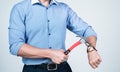 Man cropped view break wrist watch with hammer, beat the clock Royalty Free Stock Photo