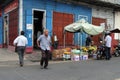 A man croses the road in central St Louis, Mauritius