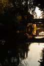 Man crossing the bridge over Chesapeake and Ohio Canal in Georgetown at sunset time , Washington D.C. Royalty Free Stock Photo