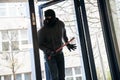 Man With Crowbar Entering Into House