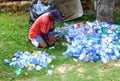 Man crushing plastic bottles