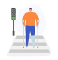 Man with crutches crossing road, green traffic light. Disabled adult male, recovery and accessibility, urban setting Royalty Free Stock Photo