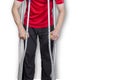 Man on crutches isolated on a white background. Concept: leg injuries, restriction in human movement, limited abilities