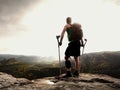 Man with a crutches in nature. Tourist with broken leg on crutches. Traveler with hurt leg in bandages