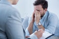 Man crying during psychotherapy