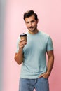 Man cup drink tea copy studio mug energy hot t-shirt hipster happy space paper coffee Royalty Free Stock Photo