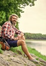 Man with cup outdoors. Man outdoors with cup of coffee. Drinking hot coffee. Enjoying nature at riverside. Guy with Royalty Free Stock Photo