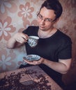 Man at a cup of strong fresh coffee at a tasting Royalty Free Stock Photo