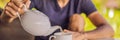 Man with a cup of tea on the cafe veranda near the rice terraces on Bali, Indonesia BANNER, LONG FORMAT Royalty Free Stock Photo