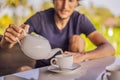 Man with a cup of tea on the cafe veranda near the rice terraces on Bali, Indonesia Royalty Free Stock Photo