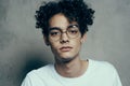 man with curly hair cropped look glasses fashion studio Royalty Free Stock Photo