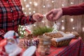 Man customer buying christmas sweets, gingerbread at the bakery giving credit card to the woman seller. Royalty Free Stock Photo