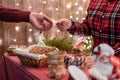 Man customer buying christmas sweets, gingerbread at the bakery giving credit card to the woman seller. Royalty Free Stock Photo