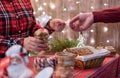 Man customer buying christmas sweets, gingerbread at the bakery giving credit card to the woman seller. Royalty Free Stock Photo