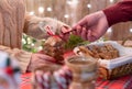 Man customer buying christmas sweets, gingerbread at the bakery giving credit card to the woman seller. Royalty Free Stock Photo