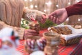 Man customer buying christmas sweets, gingerbread at the bakery giving credit card to the woman seller. Royalty Free Stock Photo