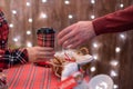 Man  customer buying hot chocolate, coffee in a paper cup, sweets at the christmas bakery. Take away. Royalty Free Stock Photo