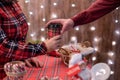 Man  customer buying hot chocolate, coffee in a paper cup, sweets at the christmas bakery. Take away. Royalty Free Stock Photo