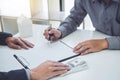 Man customer signing buying home policy document agreement, successful loan contract and salesman receive money after good deal Royalty Free Stock Photo