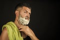 Man cut beard and mustache with razor and shaving brush