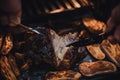 Man cut juicy roast pork belly, potatoes on baking tray cooked in oven. Traditional country cuisine. Baked fat meat. Cooked meal.