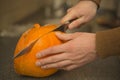 A man cut a mouldy pumpkin. Royalty Free Stock Photo