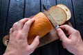 Man cuts bread Royalty Free Stock Photo