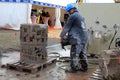 Man Cuts Concrete with ICS Chain Saw