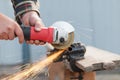 Man cuts a metal grinder. Royalty Free Stock Photo