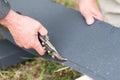 A man cuts a metal sheet with metal shears. Royalty Free Stock Photo