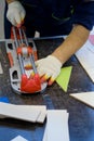 A man cuts a tile on the table, close-up Royalty Free Stock Photo