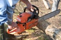 Man cuts tree with chainsaw, concept of deforestation Royalty Free Stock Photo