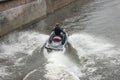 Man cuts waves on a jet ski extreme speed Royalty Free Stock Photo