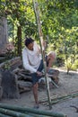 Man cutting bamboo